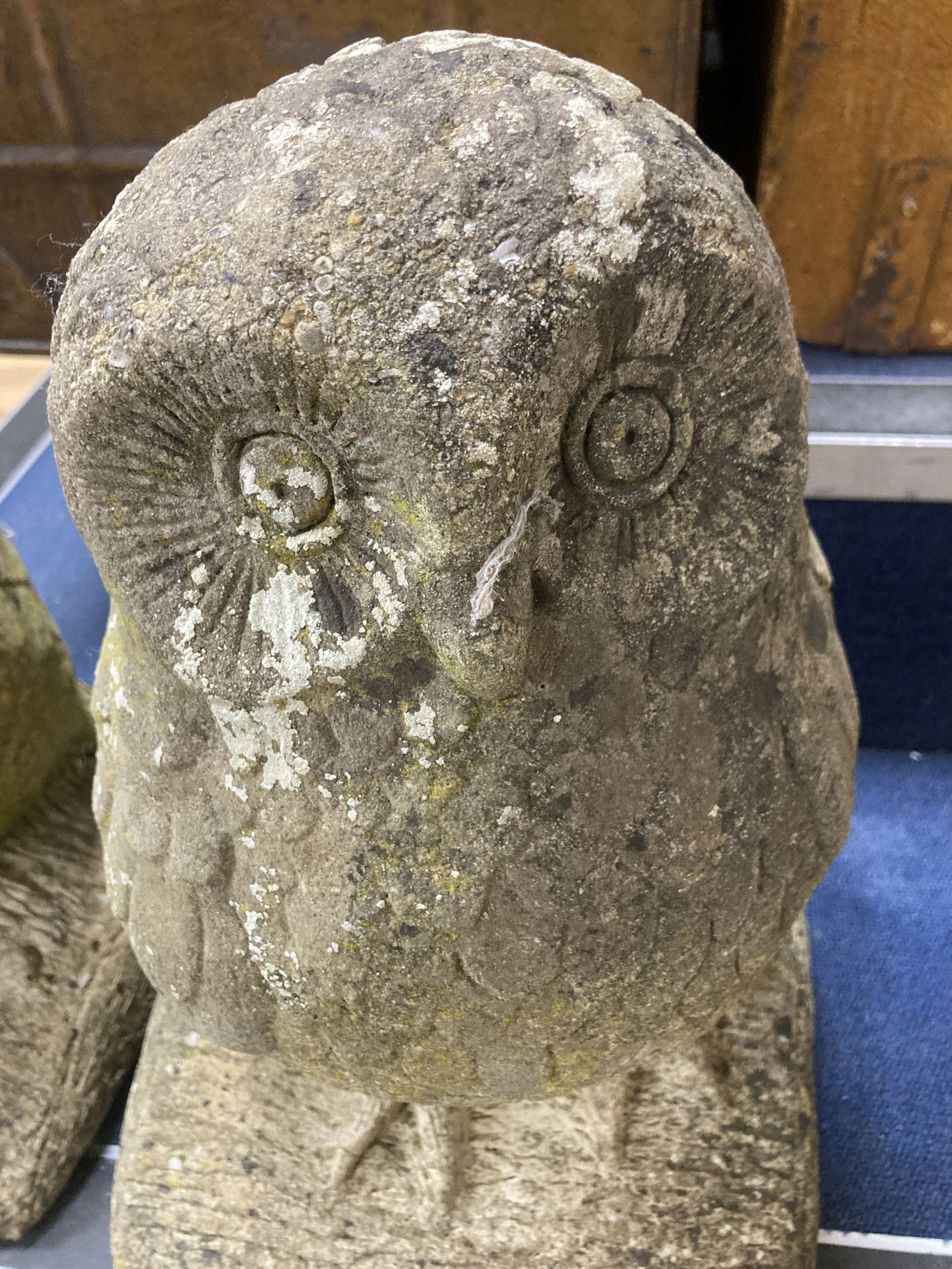 A pair of reconstituted stone owl garden ornaments, height 46cm